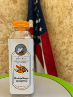 Naturally Grown Moringa Ginger Orange Peel Cold Herbal Drink bottle —  caffeine-free, nutrient-rich wellness blend by Vincent Farms Natural Foods