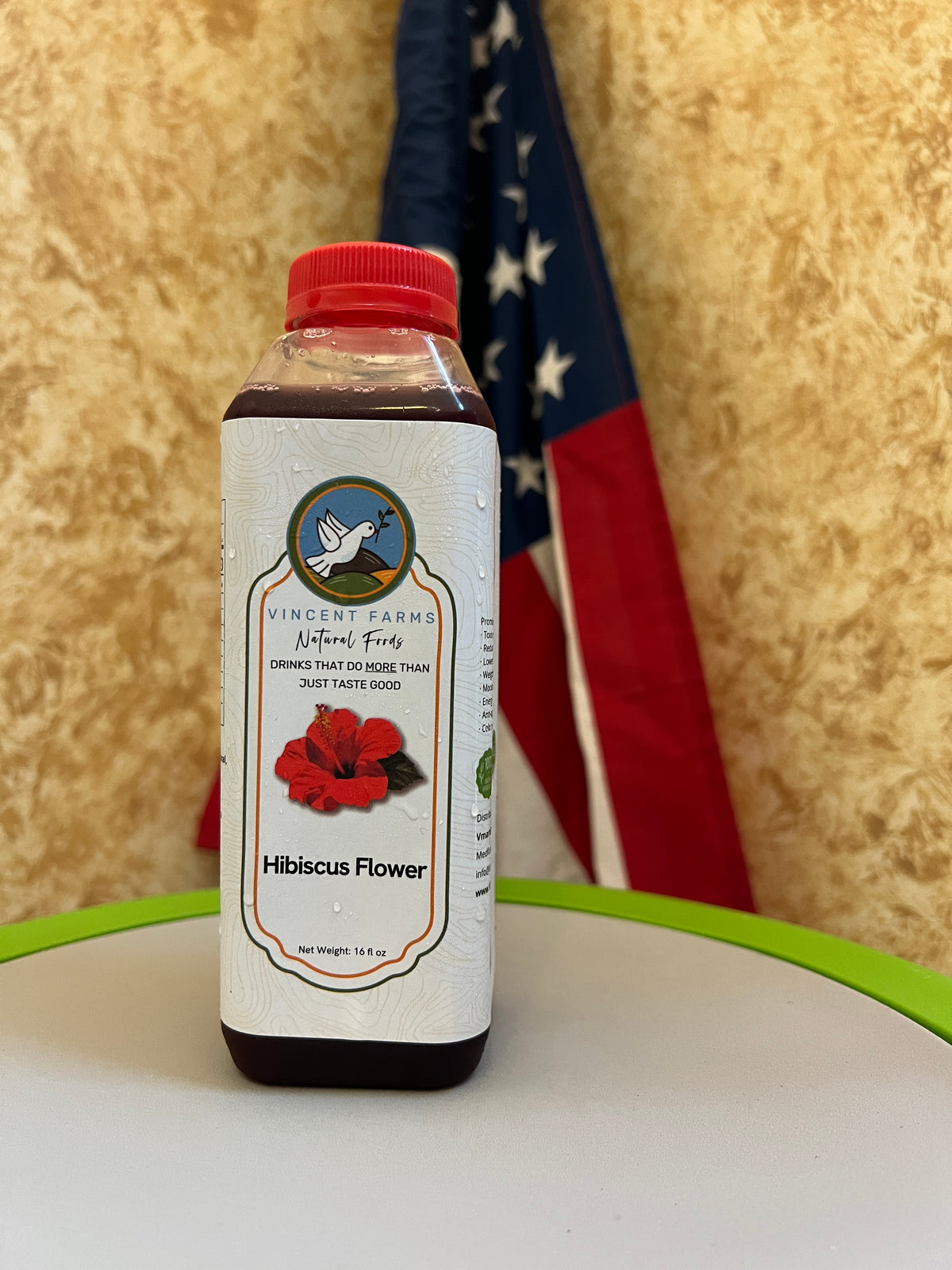Naturally Grown Hibiscus Flower Cold Herbal Drink bottle — tart, vitamin C-rich, caffeine-free refreshment by Vincent Farms Natural Foods