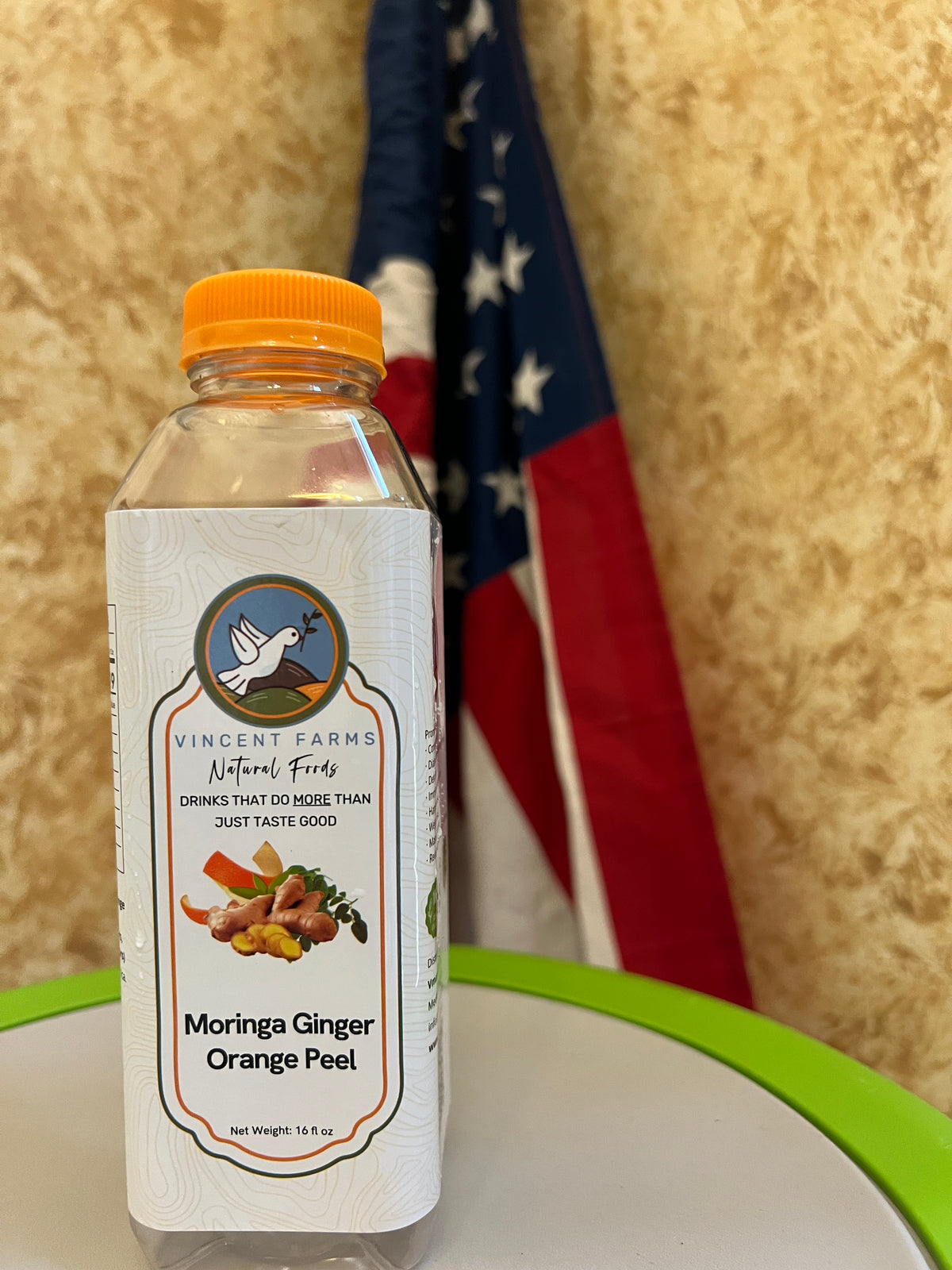 Naturally Grown Moringa Ginger Orange Peel Cold Herbal Drink bottle — caffeine-free, nutrient-rich wellness blend by Vincent Farms Natural Foods