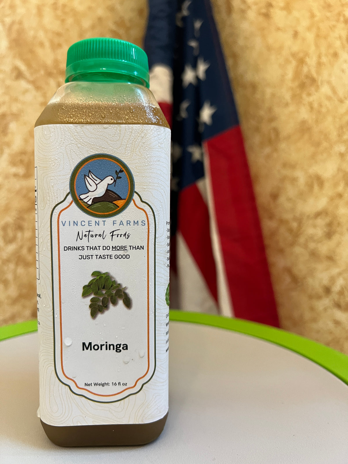 Naturally Grown Moringa Cold Herbal Drink bottle — nutrient-dense, energizing, caffeine-free wellness drink by Vincent Farms Natural Foods