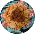 Plated stew gravy served over jollof rice — authentic West African ready-to-eat meal by Vincent Farms Natural Foods
