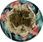 Plated cassava leaf sauce served over moringa or hibiscus leaf rice — authentic West African ready-to-eat meal by Vincent Farms Natural Foods