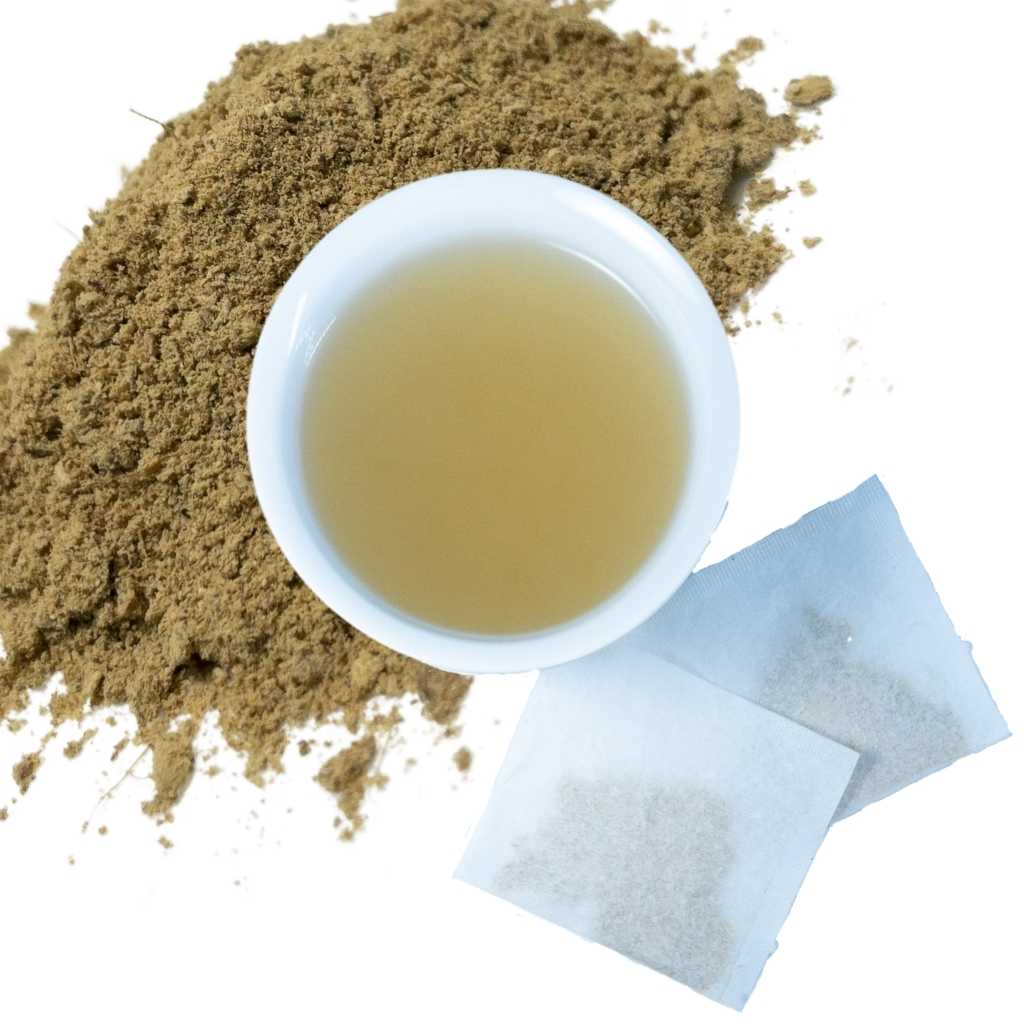 Brewed ginger root herbal tea with two tea bags and loose contents of tea bags in upper left hand corner