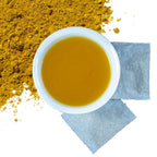 Brewed Turmeric & Ginger Root Herbal Tea with product packaging